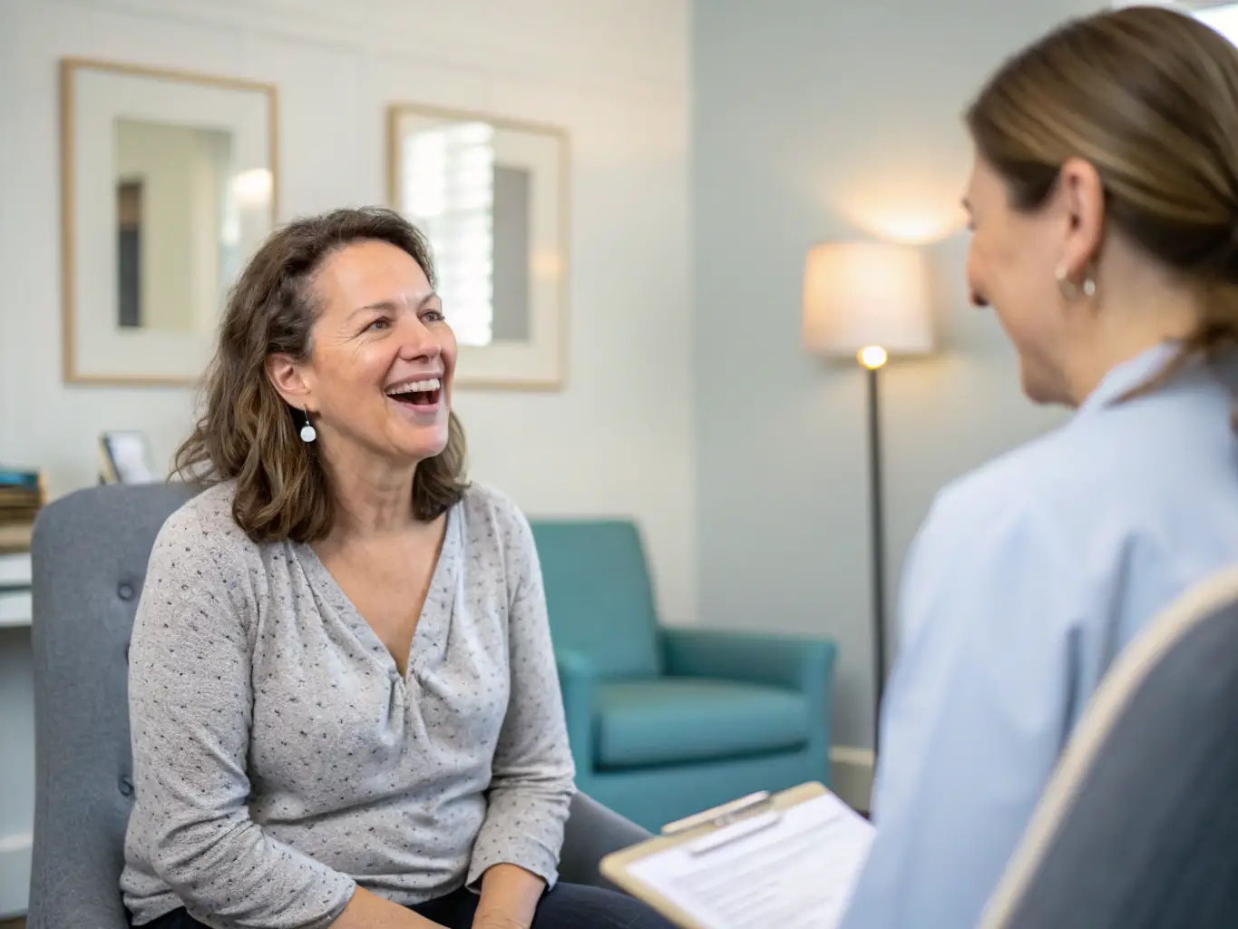 A professional image of an adult in conversation with a therapist in a calm, welcoming setting, emphasizing trust and professionalism.